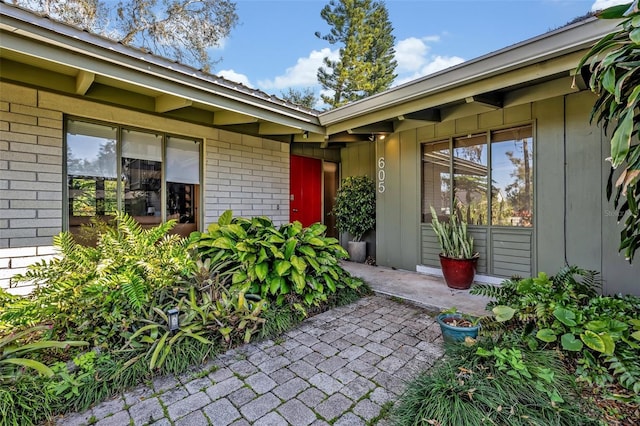 property entrance with brick siding