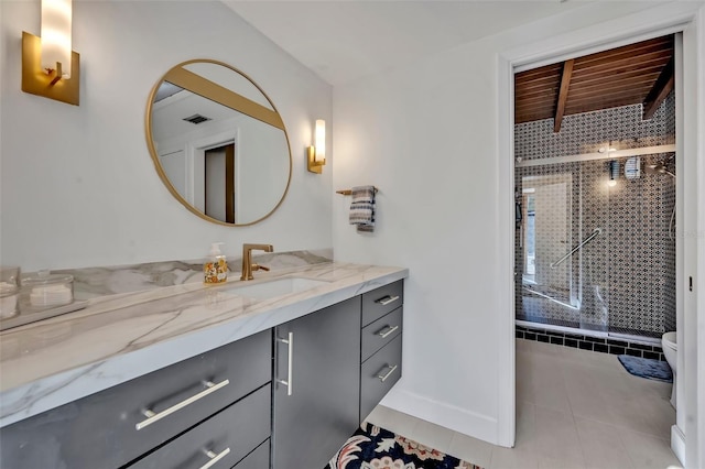 bathroom featuring a stall shower, visible vents, toilet, tile patterned flooring, and vanity