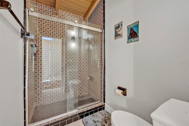 bathroom featuring lofted ceiling with beams, wooden ceiling, a shower stall, and toilet