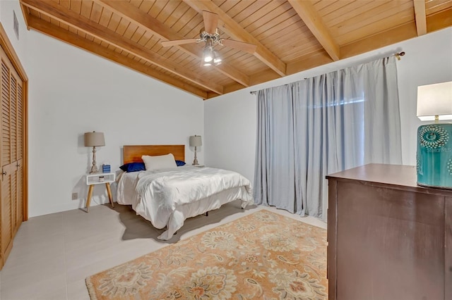 tiled bedroom with vaulted ceiling with beams, wooden ceiling, and a ceiling fan