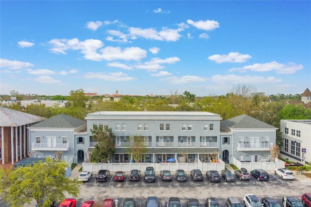 view of property featuring uncovered parking