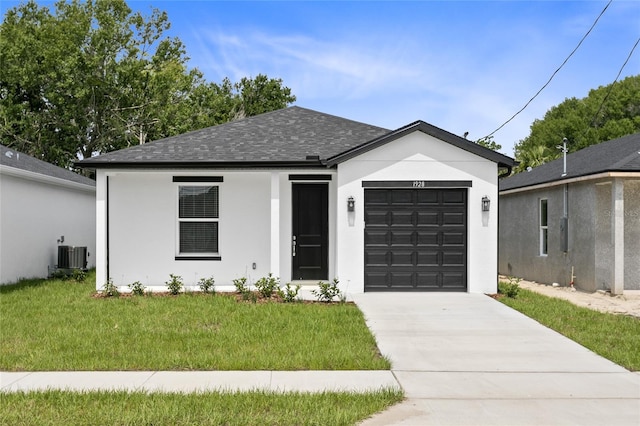 view of front facade with a garage, roof with shingles, central air condition unit, a front lawn, and stucco siding