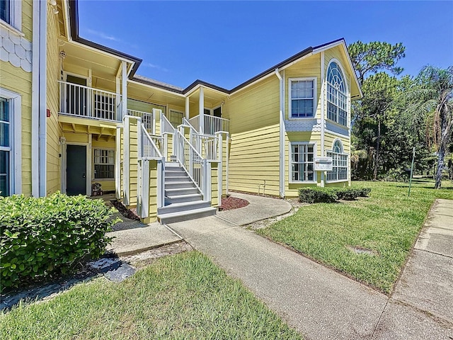 2040 Royal Bay Blvd Unit 30, Kissimmee, FL 34746 - view of front of house with stairs and a front lawn
