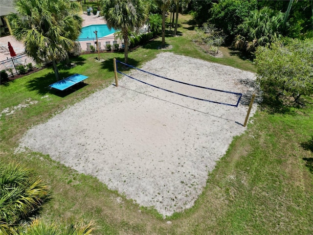 2040 Royal Bay Blvd Unit 30, Kissimmee, FL 34746 - surrounding community with gravel driveway, fence, volleyball court, and a lawn