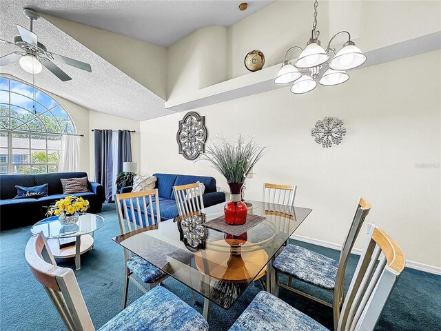 2040 Royal Bay Blvd Unit 30, Kissimmee, FL 34746 - carpeted dining area featuring a textured ceiling, vaulted ceiling, ceiling fan with notable chandelier, and baseboards