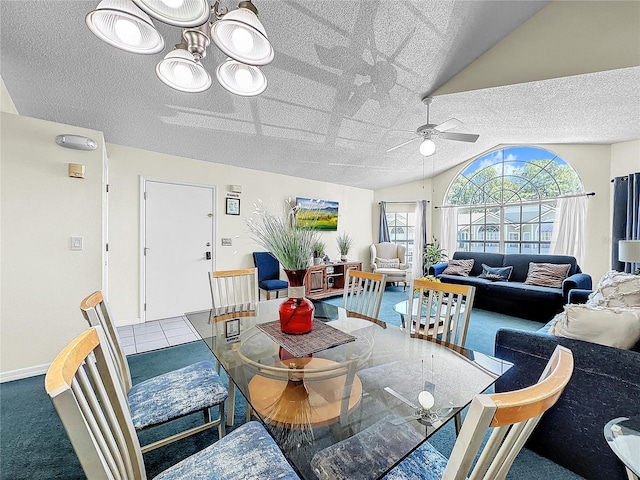 2040 Royal Bay Blvd Unit 30, Kissimmee, FL 34746 - dining room featuring lofted ceiling, ceiling fan, a textured ceiling, and baseboards