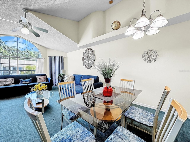 2040 Royal Bay Blvd Unit 30, Kissimmee, FL 34746 - dining space with baseboards, vaulted ceiling, a textured ceiling, carpet floors, and ceiling fan with notable chandelier