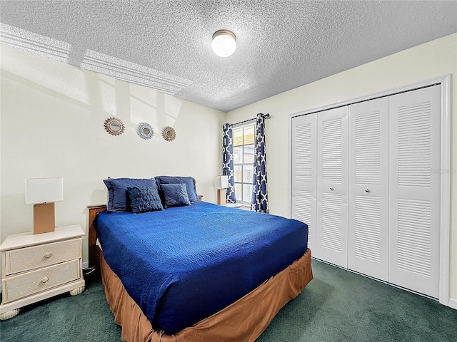2040 Royal Bay Blvd Unit 30, Kissimmee, FL 34746 - bedroom featuring a textured ceiling, dark colored carpet, and a closet