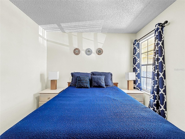 2040 Royal Bay Blvd Unit 30, Kissimmee, FL 34746 - bedroom featuring a textured ceiling