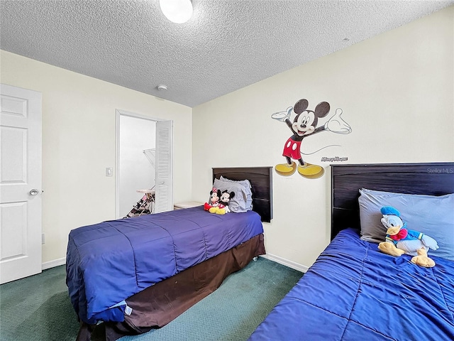 2040 Royal Bay Blvd Unit 30, Kissimmee, FL 34746 - bedroom featuring carpet flooring, a textured ceiling, and baseboards