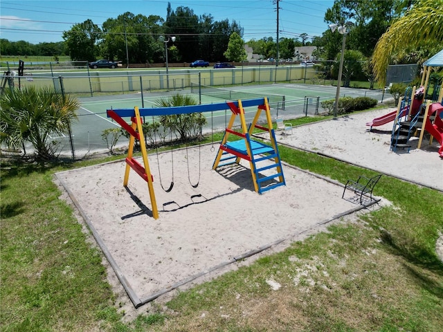2040 Royal Bay Blvd Unit 30, Kissimmee, FL 34746 - community play area with fence and a lawn