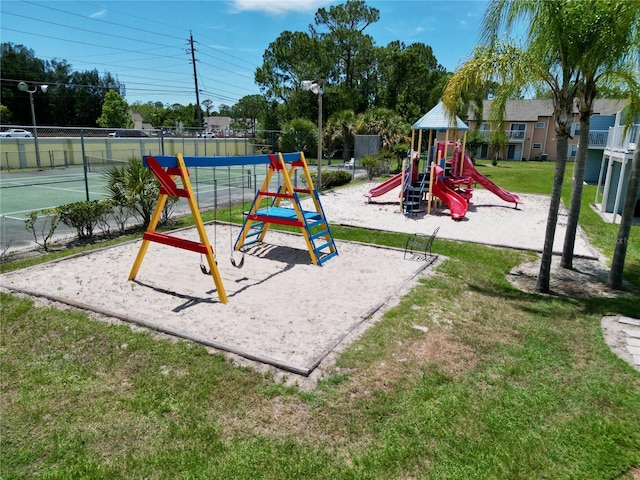 2040 Royal Bay Blvd Unit 30, Kissimmee, FL 34746 - communal playground featuring a lawn and fence