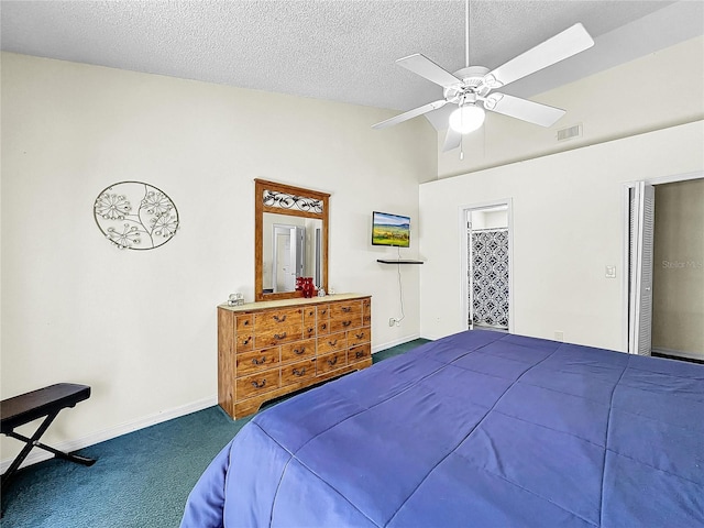 2040 Royal Bay Blvd Unit 30, Kissimmee, FL 34746 - bedroom with dark colored carpet, a textured ceiling, ceiling fan, and high vaulted ceiling