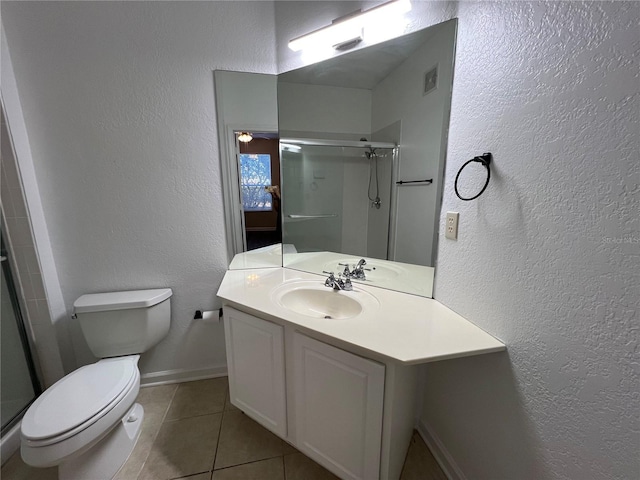 full bathroom featuring visible vents, toilet, a stall shower, vanity, and tile patterned floors