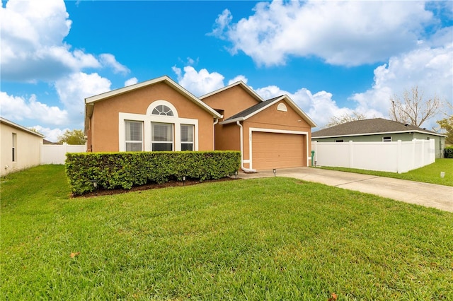 single story home featuring concrete driveway, an attached garage, fence, a front lawn, and stucco siding