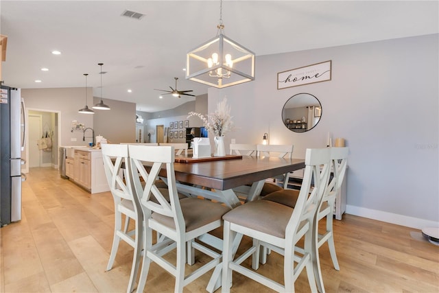 dining room featuring lofted ceiling, recessed lighting, visible vents, light wood-type flooring, and baseboards