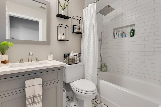 bathroom with visible vents, shower / bath combo, vanity, and toilet