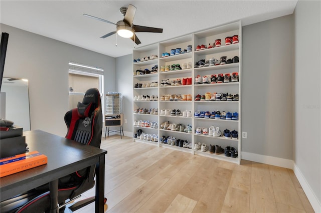 office featuring ceiling fan, wood finished floors, and baseboards