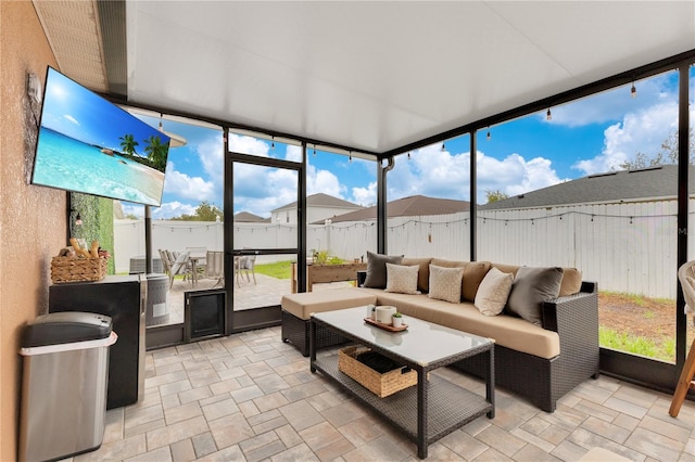 sunroom featuring a residential view