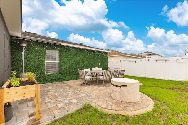 view of patio / terrace featuring outdoor dining area and fence