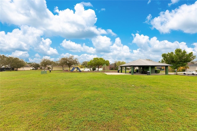 view of yard with playground community and a gazebo