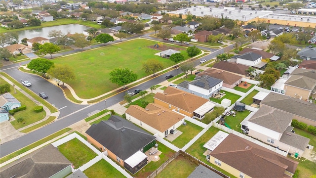 drone / aerial view with a residential view and a water view