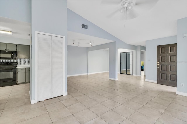 unfurnished living room featuring visible vents, ceiling fan, baseboards, and light tile patterned floors