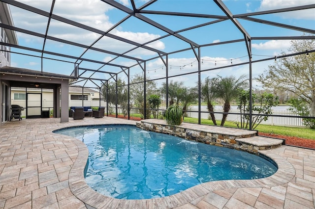 view of swimming pool with a fenced in pool, a lanai, fence, a patio area, and an outdoor living space