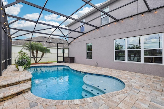 view of swimming pool featuring a lanai, a fenced in pool, and a patio