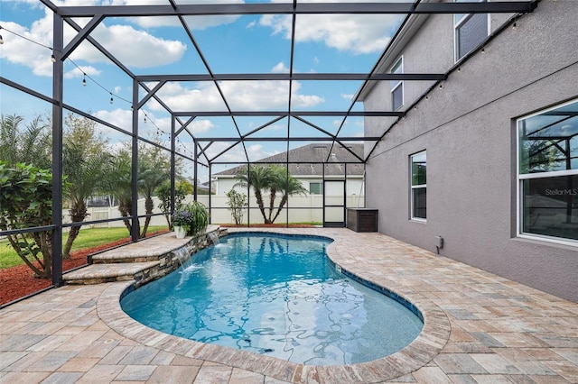 view of pool with a patio area, a lanai, and a fenced in pool