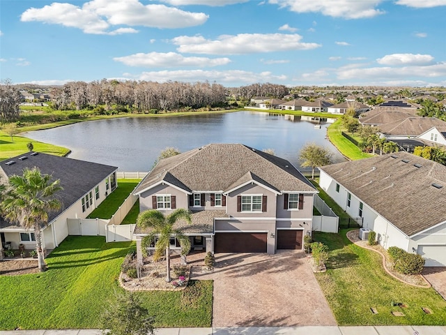 bird's eye view featuring a water view and a residential view