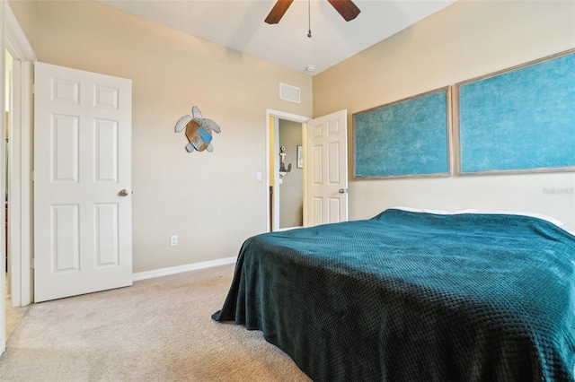 bedroom featuring carpet floors, baseboards, visible vents, and a ceiling fan