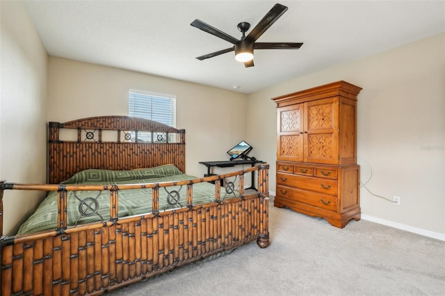 bedroom featuring carpet and baseboards