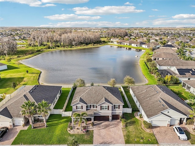 birds eye view of property featuring a water view and a residential view