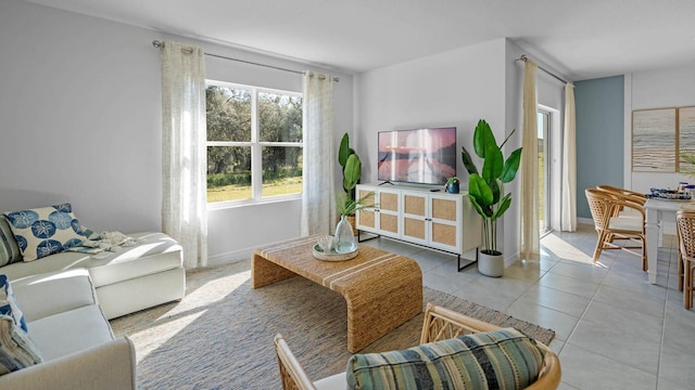 living room featuring tile patterned flooring and baseboards