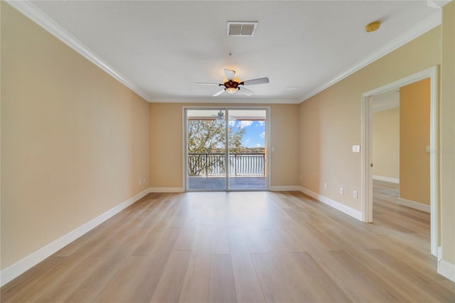 empty room with baseboards, crown molding, visible vents, and light wood-style floors