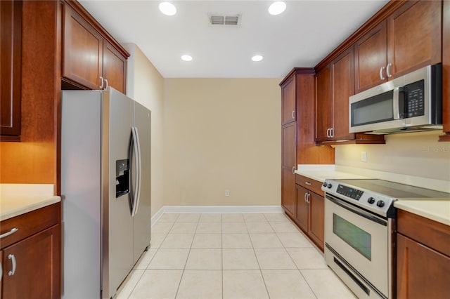 kitchen with visible vents, appliances with stainless steel finishes, light countertops, and recessed lighting