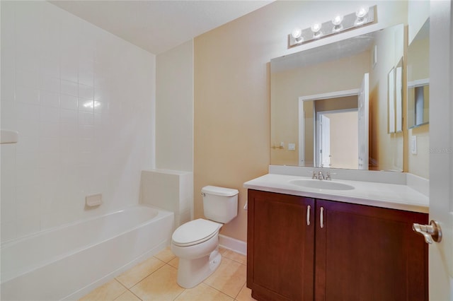 bathroom featuring tile patterned flooring, toilet, vanity, baseboards, and washtub / shower combination