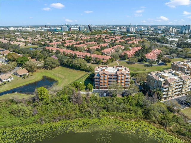 birds eye view of property featuring a view of city and a water view