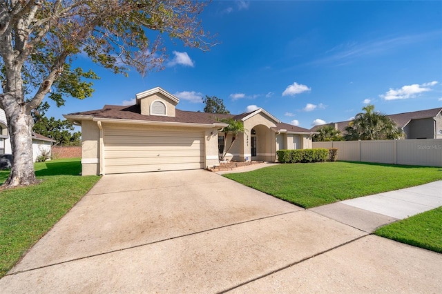 single story home with a garage, fence, driveway, and a front lawn