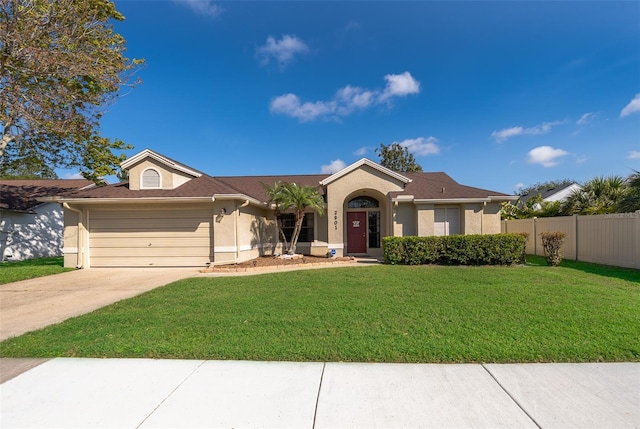 single story home with driveway, a garage, fence, a front yard, and stucco siding