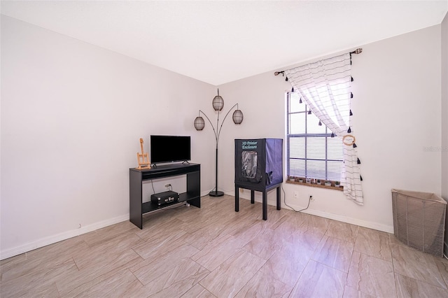 sitting room featuring baseboards