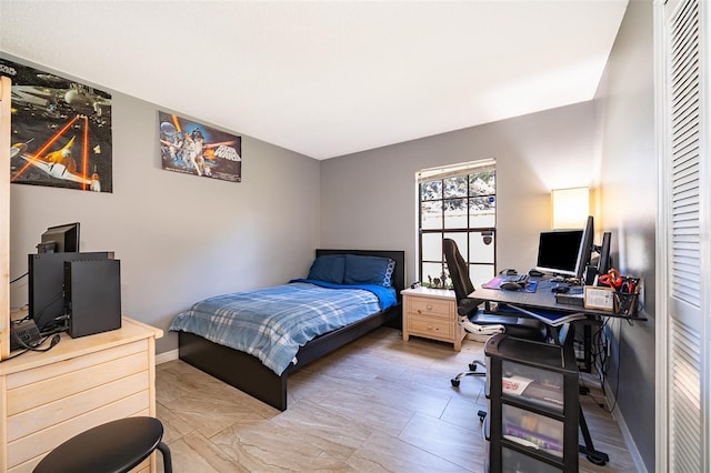 bedroom featuring baseboards