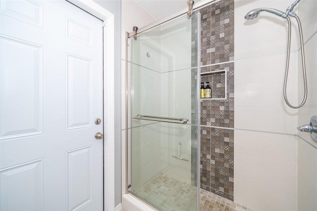 full bath with a shower stall