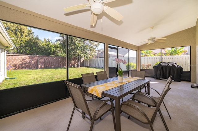 sunroom / solarium featuring a ceiling fan and vaulted ceiling