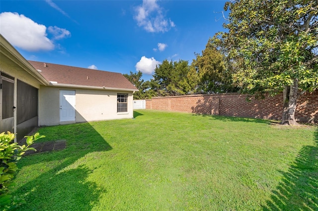 view of yard featuring fence