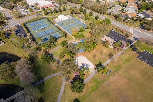 bird's eye view featuring a water view and a residential view