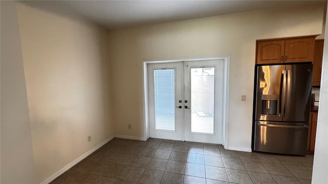 doorway to outside with tile patterned flooring, french doors, and baseboards