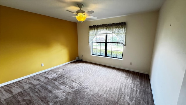 unfurnished room featuring carpet flooring, ceiling fan, and baseboards