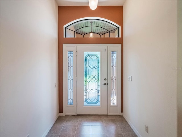 27307 Pine Straw Rd, Leesburg, FL 34748 - tiled foyer with a wealth of natural light and baseboards